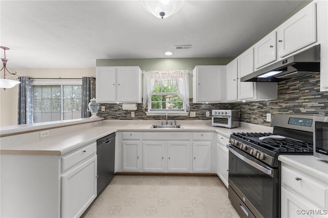 2808 Yellow Wing Ct, Henrico, VA 23231 - kitchen featuring stainless steel range with gas cooktop, under cabinet range hood, dishwasher, a sink, and white cabinets