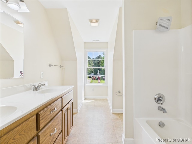 2012 Mark Pine Rd, Hayes, VA 23072 - bathroom with double vanity, shower / bathtub combination, and baseboards