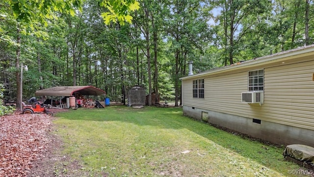 12120 Mckenney Hwy, Dinwiddie, VA 23872 - view of grassy yard featuring a detached carport, cooling unit, and view of wooded area