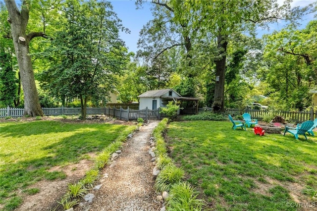4500 Forest Hill Ave, Richmond, VA 23225 - view of yard featuring an outdoor fire pit and view of wooded area