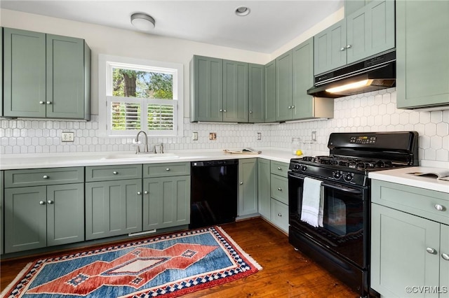 4500 Forest Hill Ave, Richmond, VA 23225 - kitchen featuring black appliances, green cabinets, under cabinet range hood, and a sink