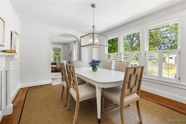 4500 Forest Hill Ave, Richmond, VA 23225 - dining space with arched walkways, hardwood / wood-style flooring, healthy amount of natural light, and baseboards
