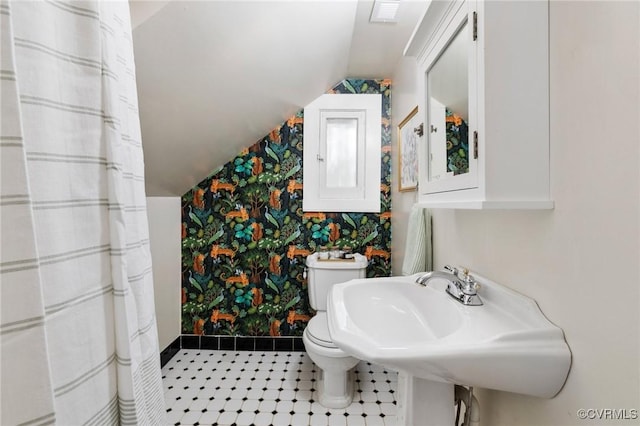 4500 Forest Hill Ave, Richmond, VA 23225 - bathroom featuring wallpapered walls, baseboards, vaulted ceiling, toilet, and a sink