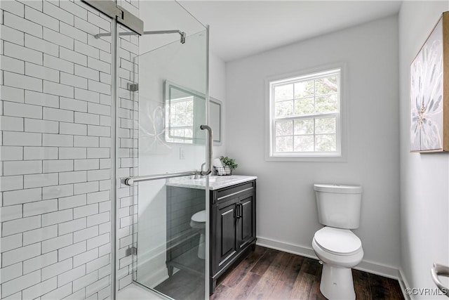 6904 Three Chopt Rd, Richmond, VA 23226 - full bathroom with toilet, a stall shower, wood finished floors, and baseboards