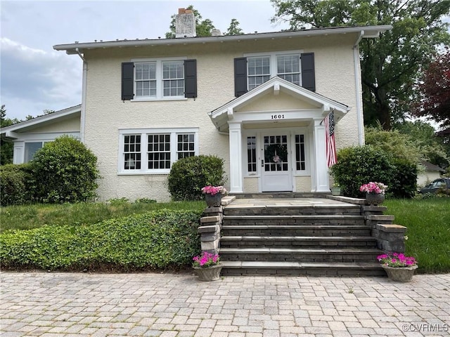 1601 Princeton Rd, Richmond, VA 23227 - view of front of house with a chimney and stucco siding