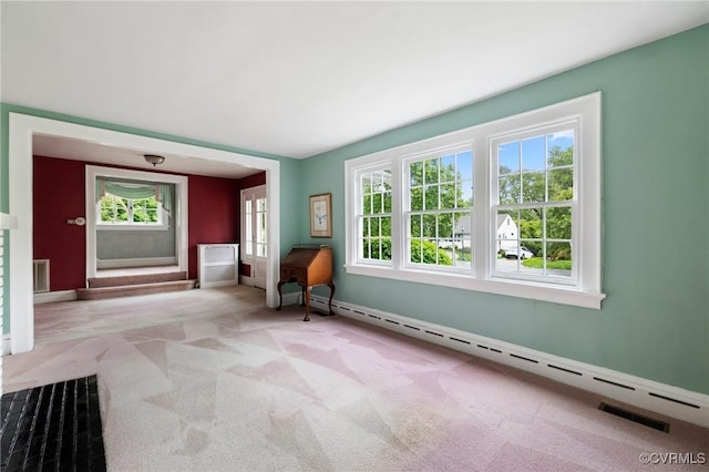 1601 Princeton Rd, Richmond, VA 23227 - unfurnished room featuring a baseboard heating unit, carpet, plenty of natural light, and baseboards