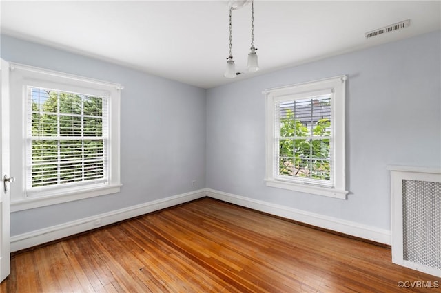 1601 Princeton Rd, Richmond, VA 23227 - spare room with plenty of natural light, baseboards, and wood-type flooring