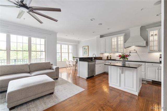 3806 Wild Goose Walk, Henrico, VA 23060 - kitchen with custom exhaust hood, open floor plan, ornamental molding, stainless steel dishwasher, and dark countertops