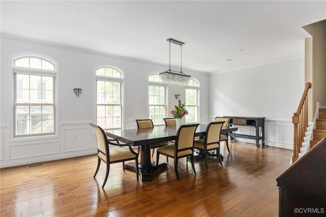 3806 Wild Goose Walk, Henrico, VA 23060 - dining room featuring ornamental molding, stairway, a decorative wall, wainscoting, and wood finished floors