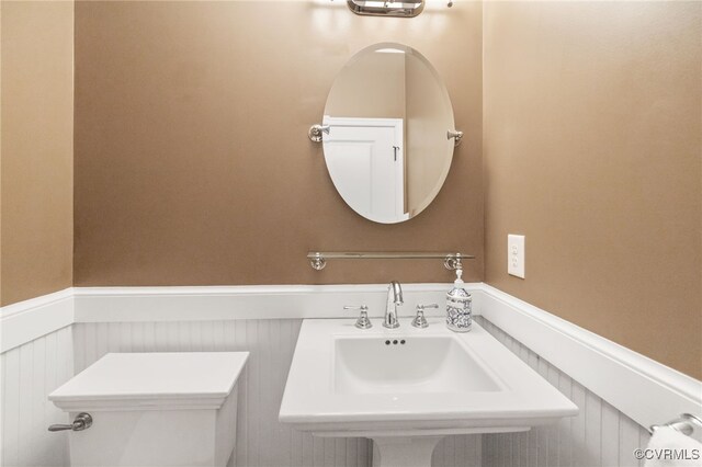 3806 Wild Goose Walk, Henrico, VA 23060 - half bathroom with a wainscoted wall, a sink, and toilet