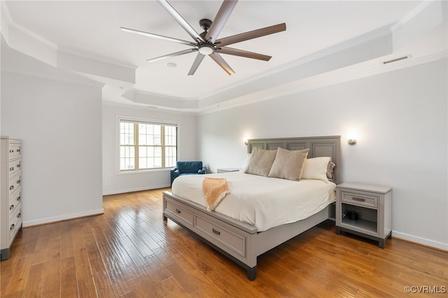 3806 Wild Goose Walk, Henrico, VA 23060 - bedroom featuring a tray ceiling, ornamental molding, wood-type flooring, baseboards, and ceiling fan