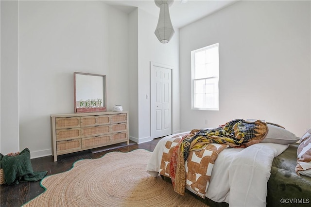 122 Elm St, Petersburg, VA 23803 - bedroom featuring baseboards, wood finished floors, and a towering ceiling