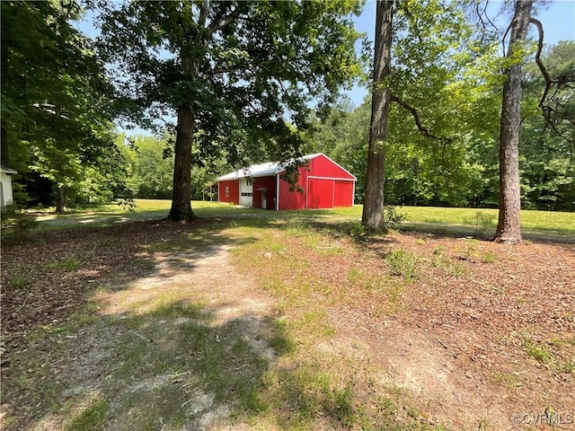 2458 Happy Hill Ln, Mechanicsville, VA 23111 - view of yard with a pole building, a detached garage, and an outdoor structure