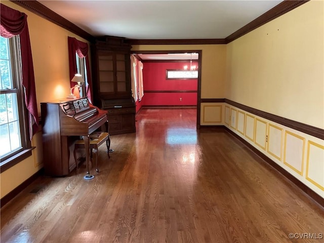 2458 Happy Hill Ln, Mechanicsville, VA 23111 - hall with crown molding, dark wood-type flooring, and a wainscoted wall