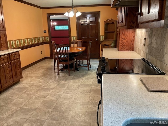 2458 Happy Hill Ln, Mechanicsville, VA 23111 - dining space featuring ornamental molding, a chandelier, and baseboards
