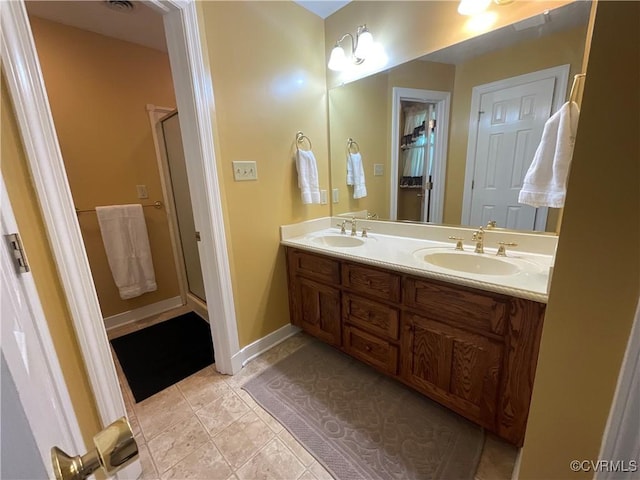 2458 Happy Hill Ln, Mechanicsville, VA 23111 - bathroom featuring double vanity, a stall shower, and tile patterned floors