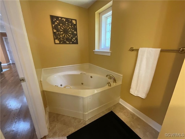 2458 Happy Hill Ln, Mechanicsville, VA 23111 - bathroom with a tub with jets and baseboards
