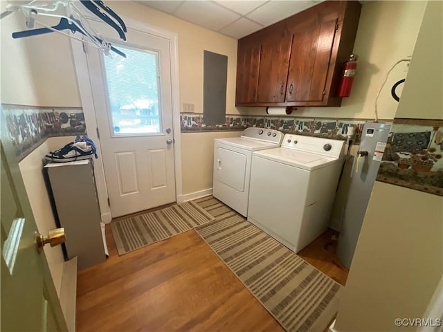 2458 Happy Hill Ln, Mechanicsville, VA 23111 - laundry room with cabinet space, washing machine and dryer, and light wood-style flooring