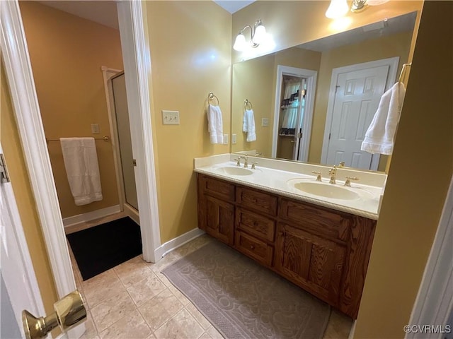 2458 Happy Hill Ln, Mechanicsville, VA 23111 - bathroom with double vanity, a stall shower, and tile patterned floors