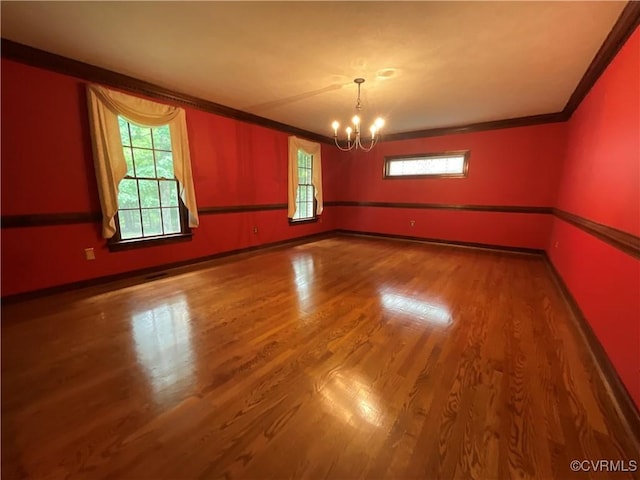 2458 Happy Hill Ln, Mechanicsville, VA 23111 - spare room featuring a chandelier, ornamental molding, wood finished floors, and baseboards