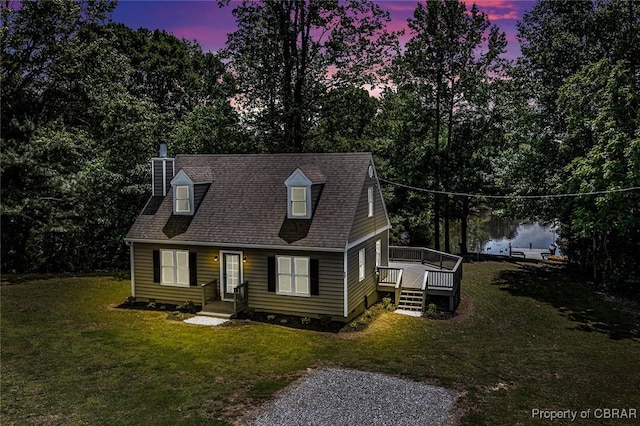 647 Lakeview Dr, Heathsville, VA 22473 - cape cod-style house with a chimney, a lawn, and a wooden deck
