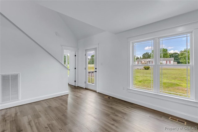 647 Lakeview Dr, Heathsville, VA 22473 - unfurnished living room with wood finished floors, baseboards, and lofted ceiling
