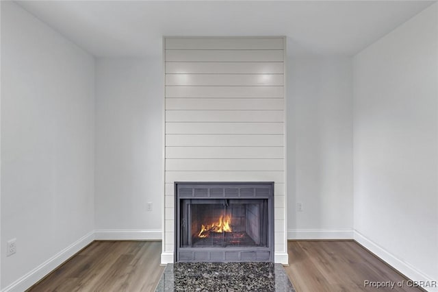 647 Lakeview Dr, Heathsville, VA 22473 - detailed view of wood finished floors, baseboards, and a fireplace