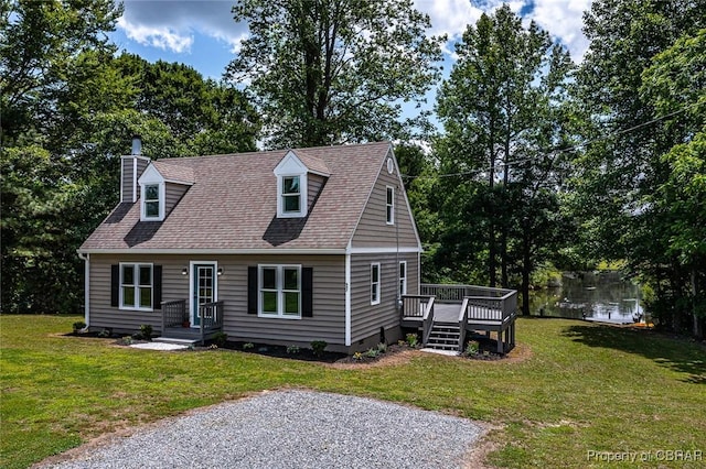 647 Lakeview Dr, Heathsville, VA 22473 - cape cod home with a deck, a chimney, crawl space, roof with shingles, and view of wooded area