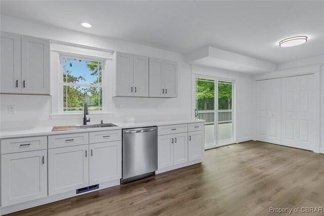 647 Lakeview Dr, Heathsville, VA 22473 - kitchen featuring dishwasher, a sink, light countertops, recessed lighting, and wood finished floors