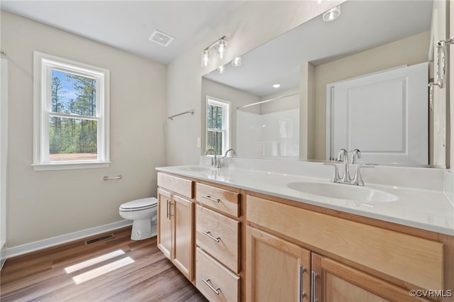 TBD Vista Lane, Mineral, VA 23117 - bathroom featuring double vanity, toilet, baseboards, wood finished floors, and a shower