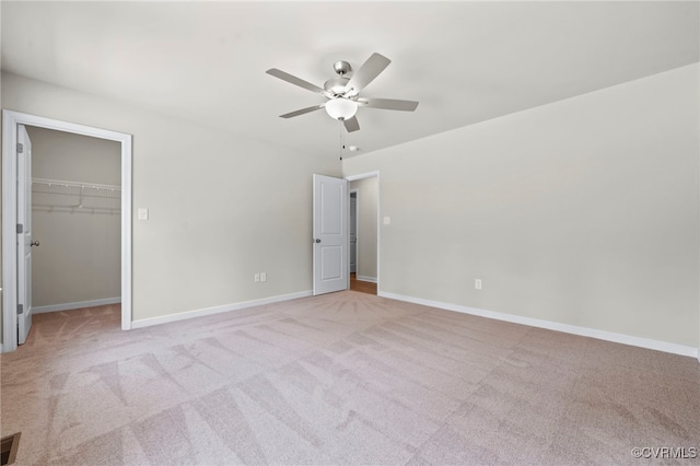 TBD Vista Lane, Mineral, VA 23117 - unfurnished bedroom with light carpet, baseboards, a spacious closet, a ceiling fan, and a closet