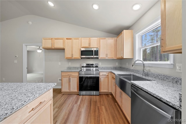 TBD Vista Lane, Mineral, VA 23117 - kitchen with stainless steel appliances, light brown cabinets, a sink, lofted ceiling, and light wood-style flooring