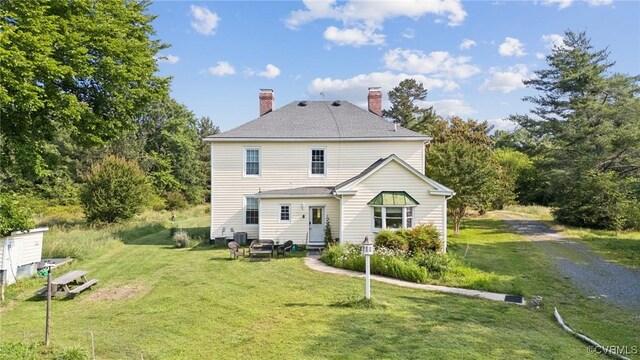 36 Carter Rd, Cumberland, VA 23040 - back of property with a chimney and a yard