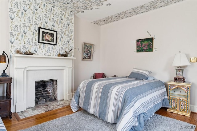 36 Carter Rd, Cumberland, VA 23040 - bedroom featuring wood finished floors and a fireplace with flush hearth