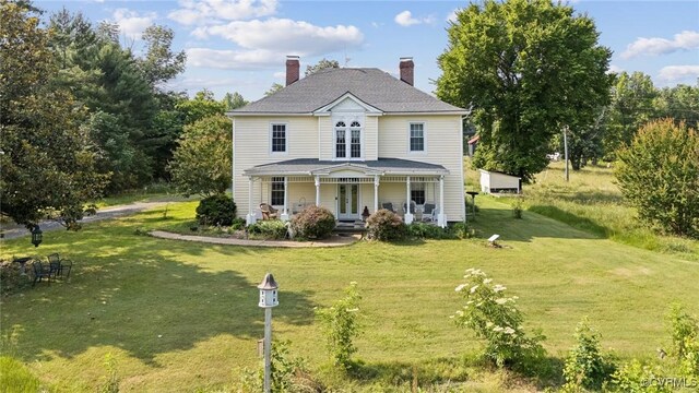 36 Carter Rd, Cumberland, VA 23040 - view of front of house with french doors, covered porch, a front lawn, and a chimney