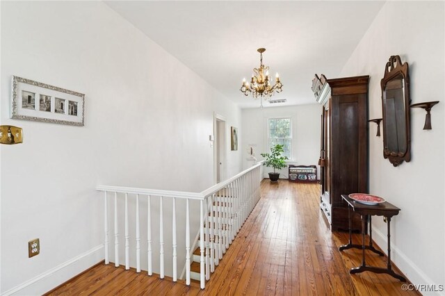 36 Carter Rd, Cumberland, VA 23040 - hallway featuring an upstairs landing, a chandelier, wood-type flooring, and baseboards