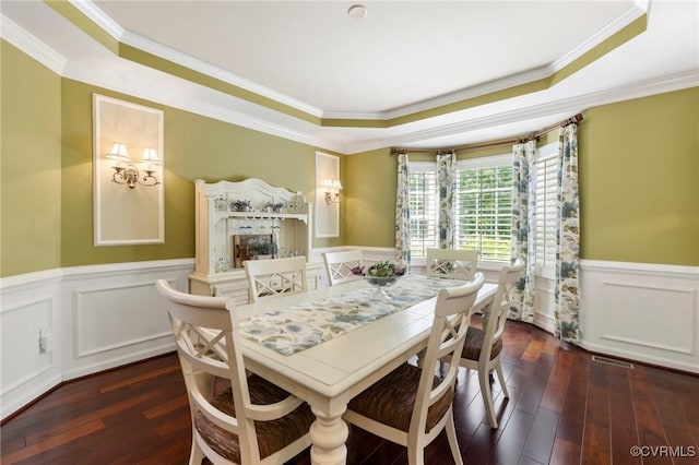 4030 Water Overlook Blvd, Midlothian, VA 23112 - dining space with a raised ceiling, a wainscoted wall, ornamental molding, and wood-type flooring