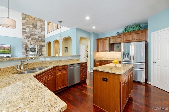 4030 Water Overlook Blvd, Midlothian, VA 23112 - kitchen with stainless steel appliances, a sink, brown cabinets, dark wood-type flooring, and recessed lighting
