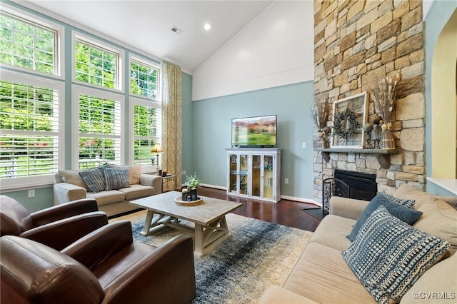 4030 Water Overlook Blvd, Midlothian, VA 23112 - living area with a stone fireplace, wood finished floors, high vaulted ceiling, baseboards, and arched walkways