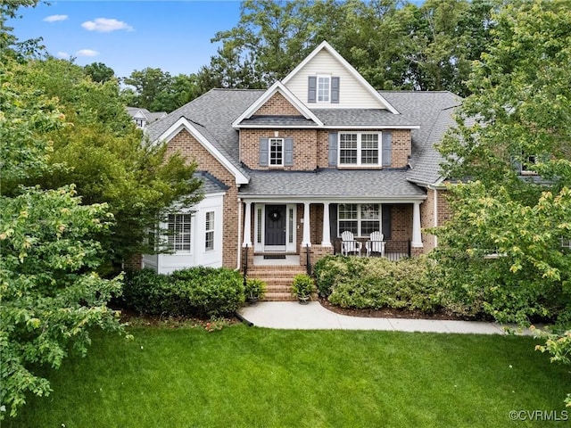 4030 Water Overlook Blvd, Midlothian, VA 23112 - view of front of home with brick siding, a front yard, roof with shingles, and a porch