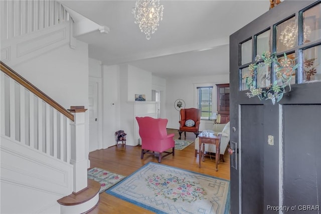 159 Fleeton Point Cir, Reedville, VA 22539 - entryway featuring stairway, wood finished floors, and a chandelier