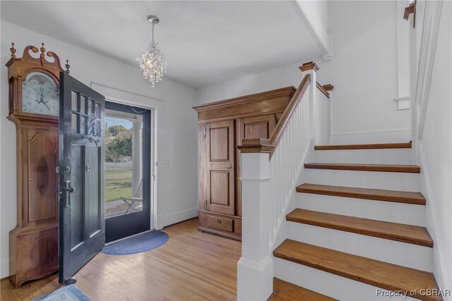 159 Fleeton Point Cir, Reedville, VA 22539 - entrance foyer featuring stairs, light wood-type flooring, and a chandelier
