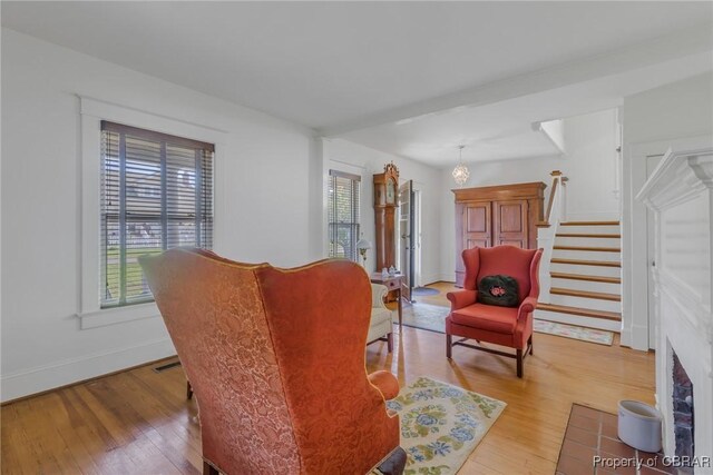 159 Fleeton Point Cir, Reedville, VA 22539 - living area featuring light wood-style flooring, stairway, baseboards, and a fireplace