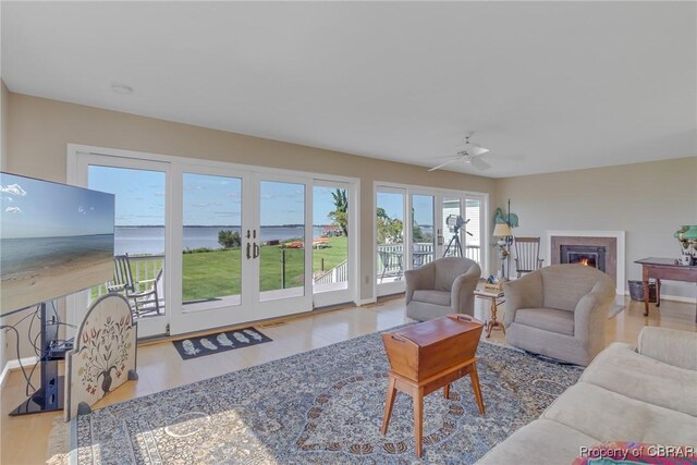 159 Fleeton Point Cir, Reedville, VA 22539 - living area featuring ceiling fan, a warm lit fireplace, and wood finished floors
