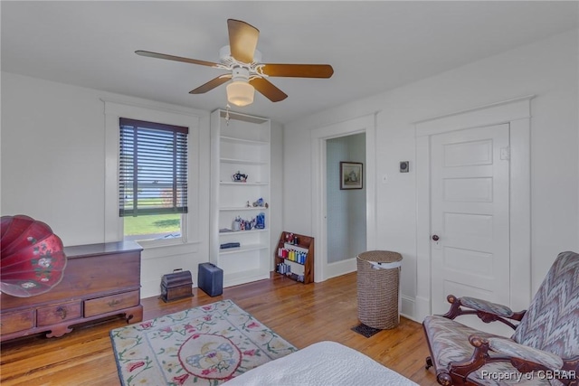 159 Fleeton Point Cir, Reedville, VA 22539 - sitting room with wood finished floors, a ceiling fan, and baseboards