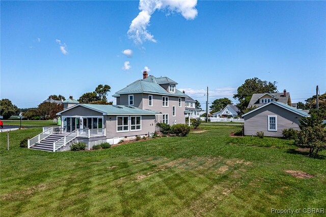159 Fleeton Point Cir, Reedville, VA 22539 - back of house with a yard, a chimney, and a porch