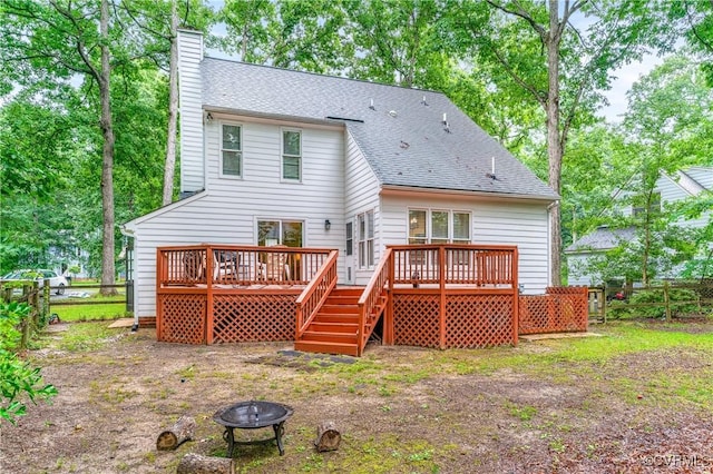 13710 Arrowood Ct, Midlothian, VA 23112 - rear view of house featuring an outdoor fire pit, a chimney, a wooden deck, and a shingled roof