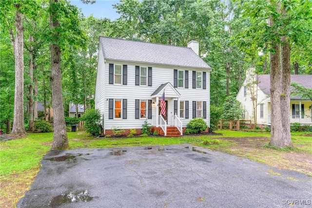 13710 Arrowood Ct, Midlothian, VA 23112 - colonial house featuring a chimney and a front yard