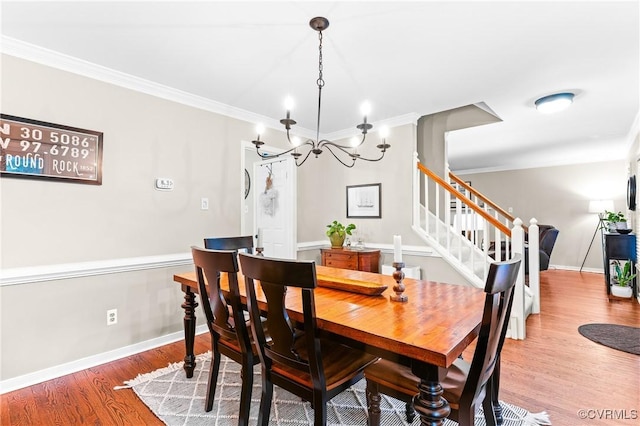 13710 Arrowood Ct, Midlothian, VA 23112 - dining space featuring stairway, ornamental molding, a chandelier, wood finished floors, and baseboards