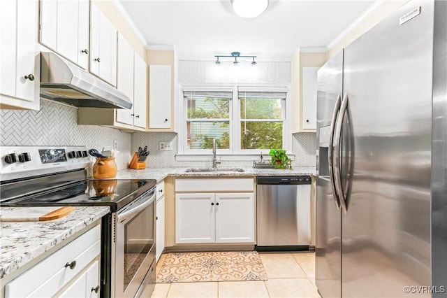 13710 Arrowood Ct, Midlothian, VA 23112 - kitchen with appliances with stainless steel finishes, under cabinet range hood, a sink, crown molding, and light tile patterned floors